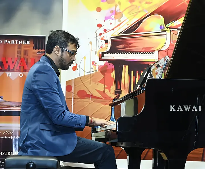 Kaushik Das playing the Kawai grand at Confluence 2025