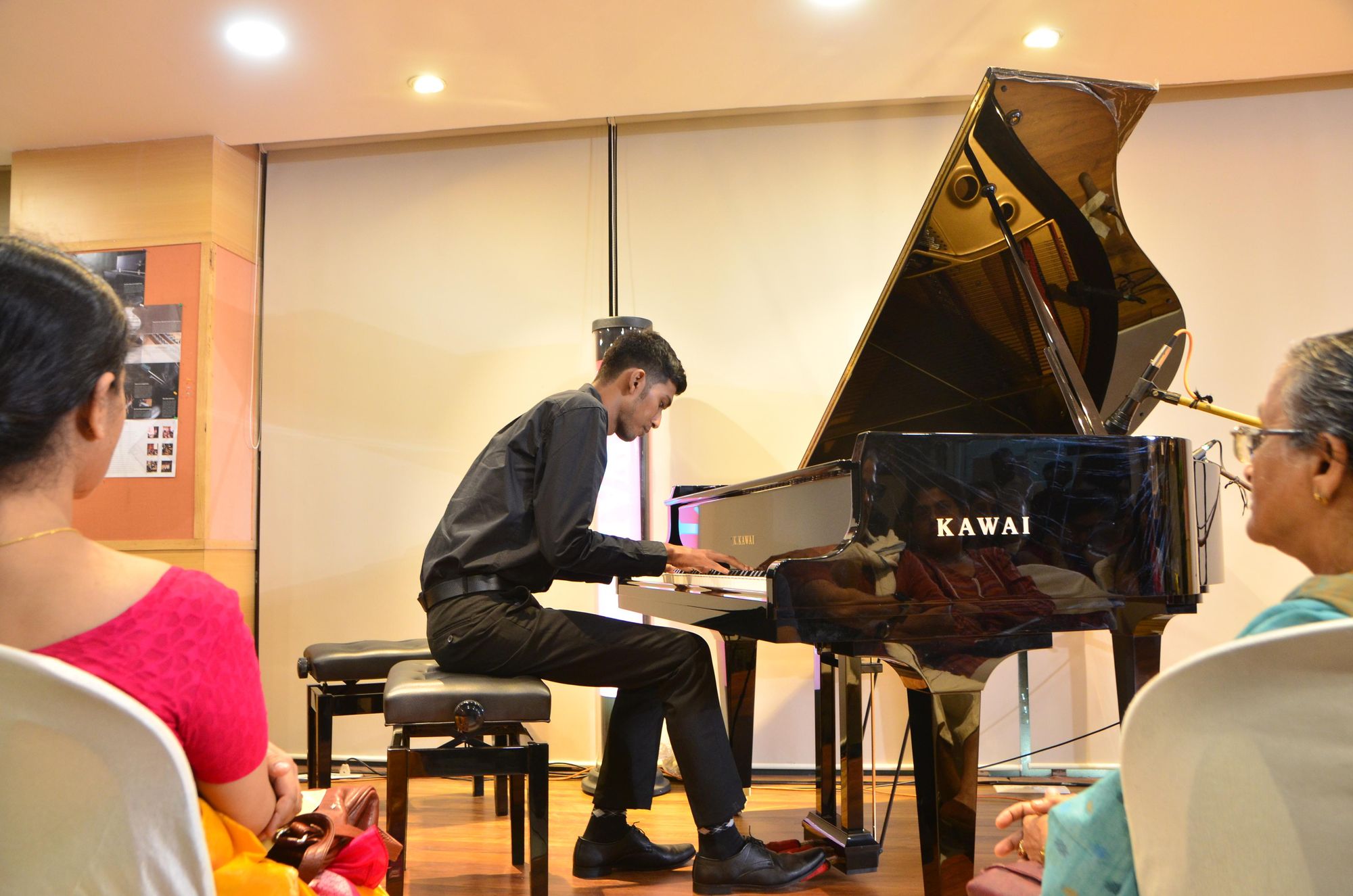 A student performing on a Kawai grand at the annual recital